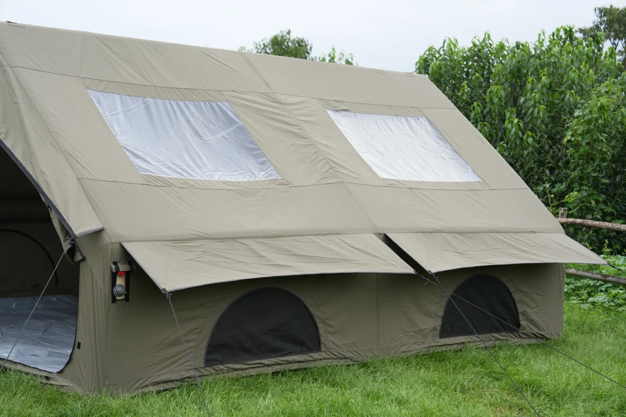 Twelve square metre inflatable canvas tent with its front fully opened