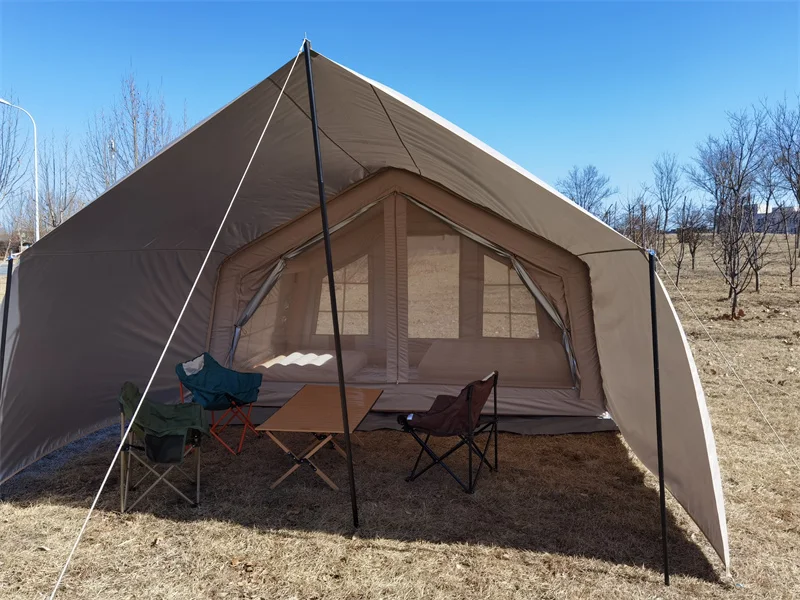 Nine square metre inflatable cabin tent with its canopy and mesh entrance open
