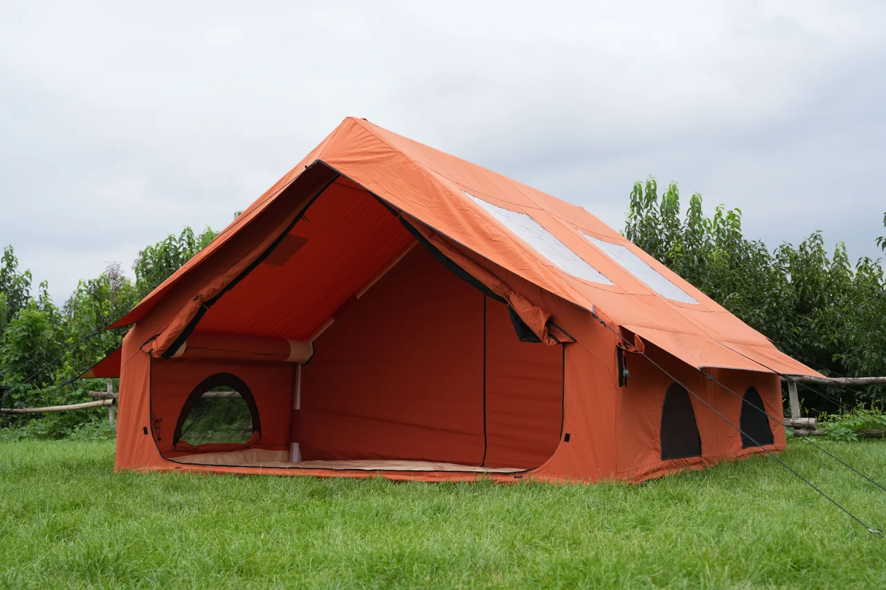 Orange 12 square metre inflatable canvas lodge with its front open