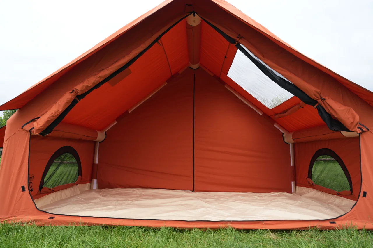 Open interior of an orange 12 square metre inflatable lodge