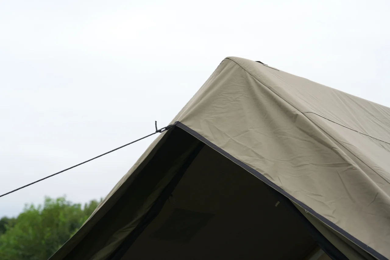 Roof edge and guy-line detail on a 12 square metre inflatable lodge