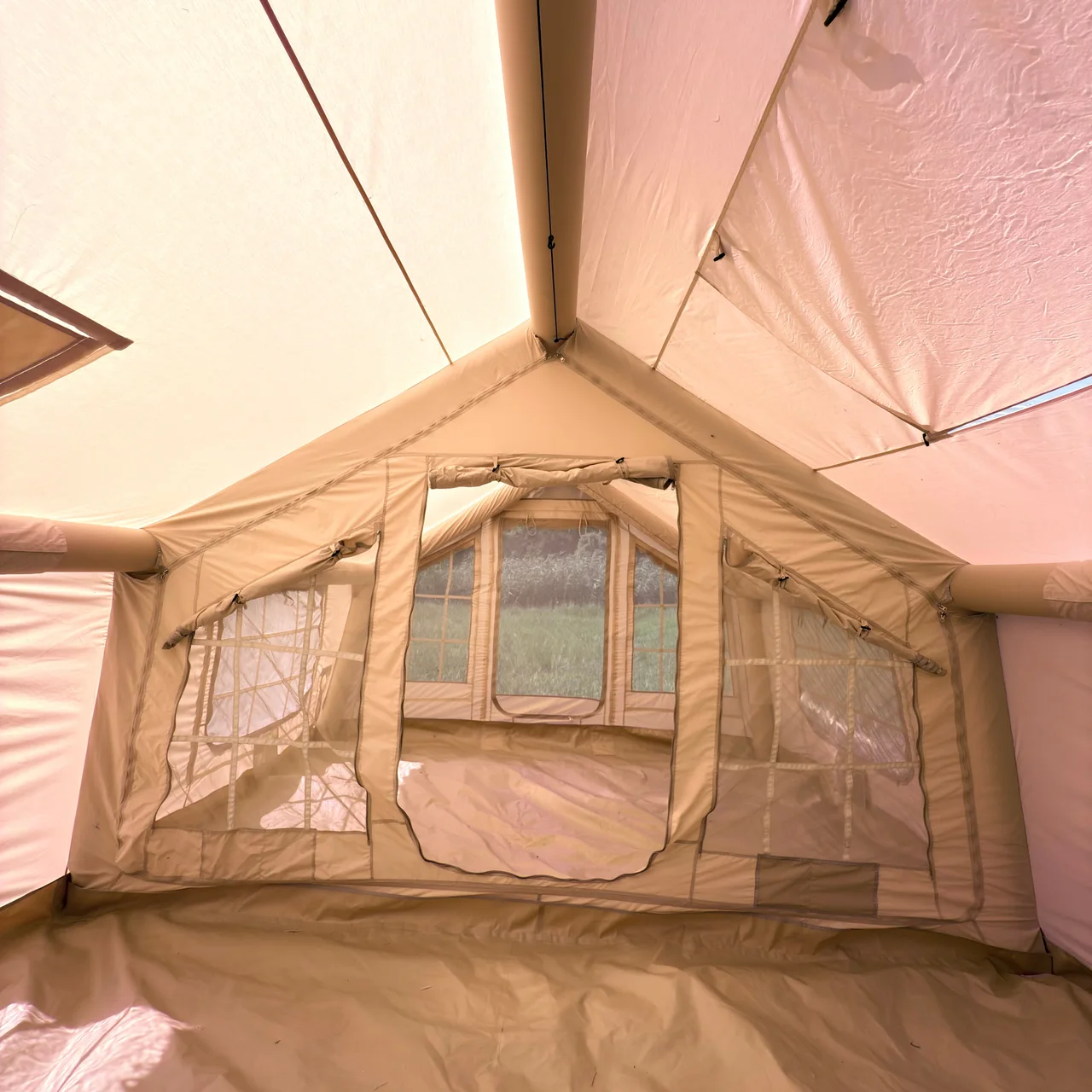 Interior of an LT-18.16 inflatable camping tent showing the open living area and partition zone