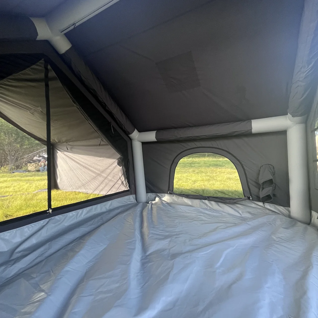 Interior of an LT-07 inflatable tent showing the air frame, floor and openings