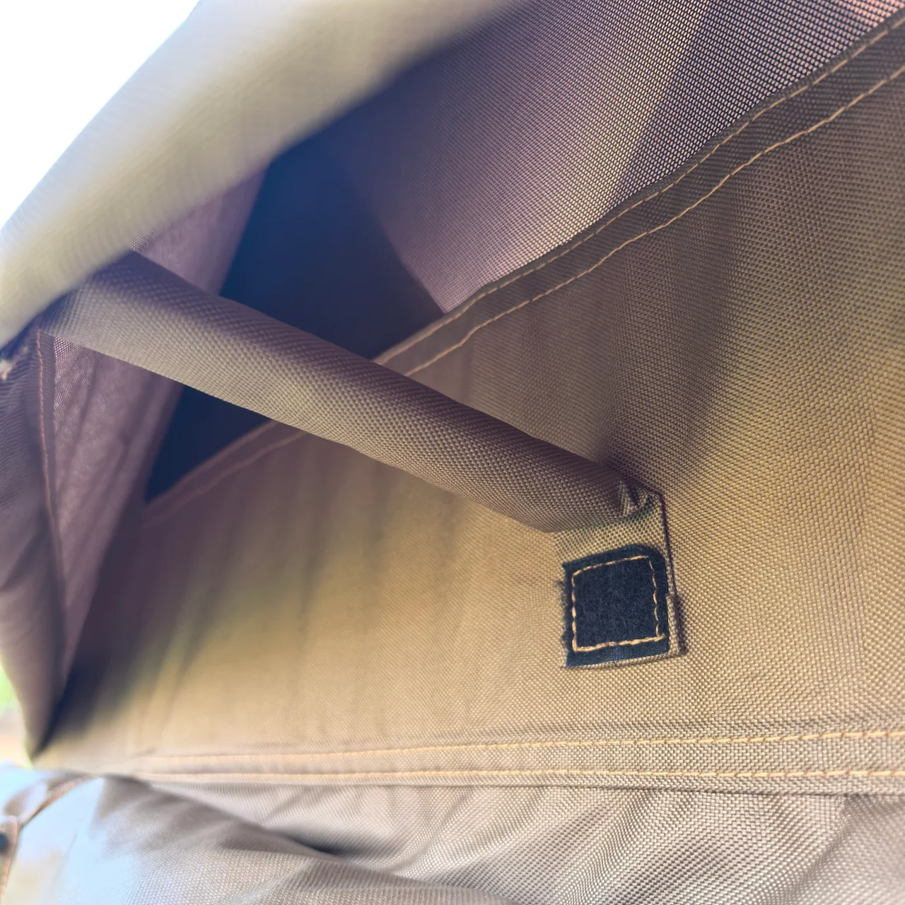 Interior fabric sleeve, stitched attachment and hook-and-loop point on an LT-07 tent sample