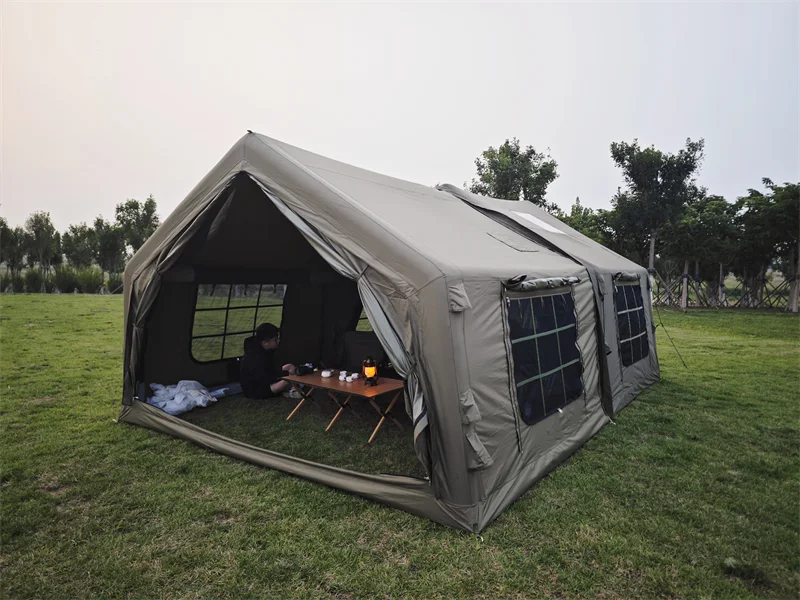 Army green modular inflatable camping tent with an open entrance