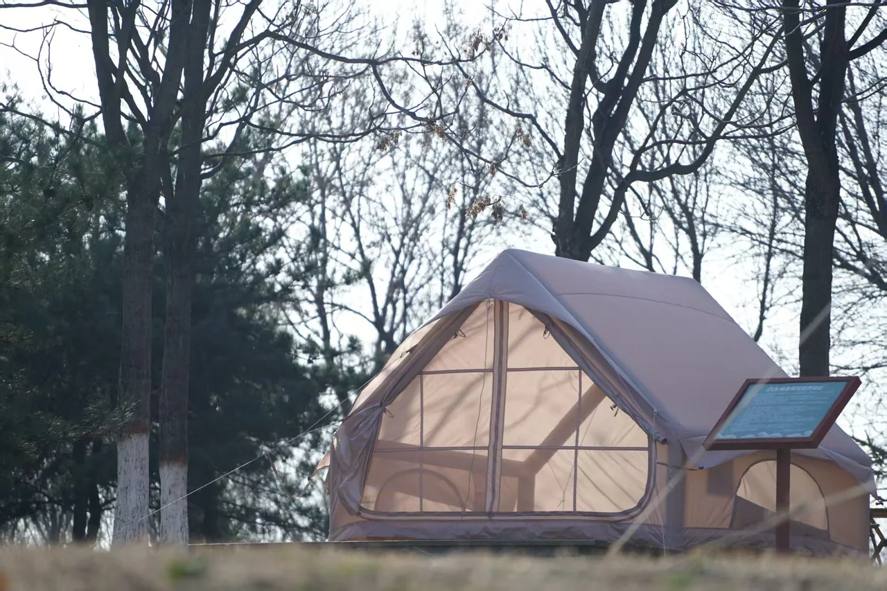 Compact LT-6.3 inflatable camping tent viewed from the front outdoors
