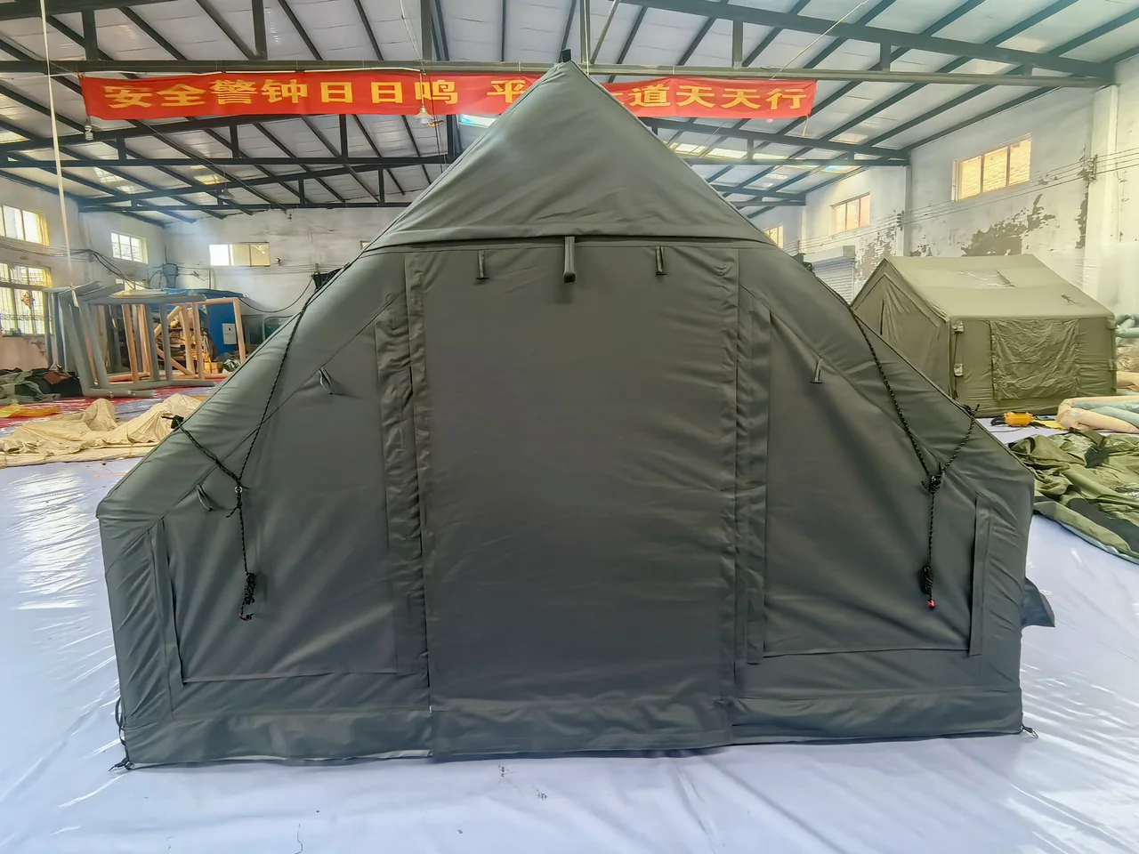 Twelve square metre inflatable camping tent shown inside the workshop