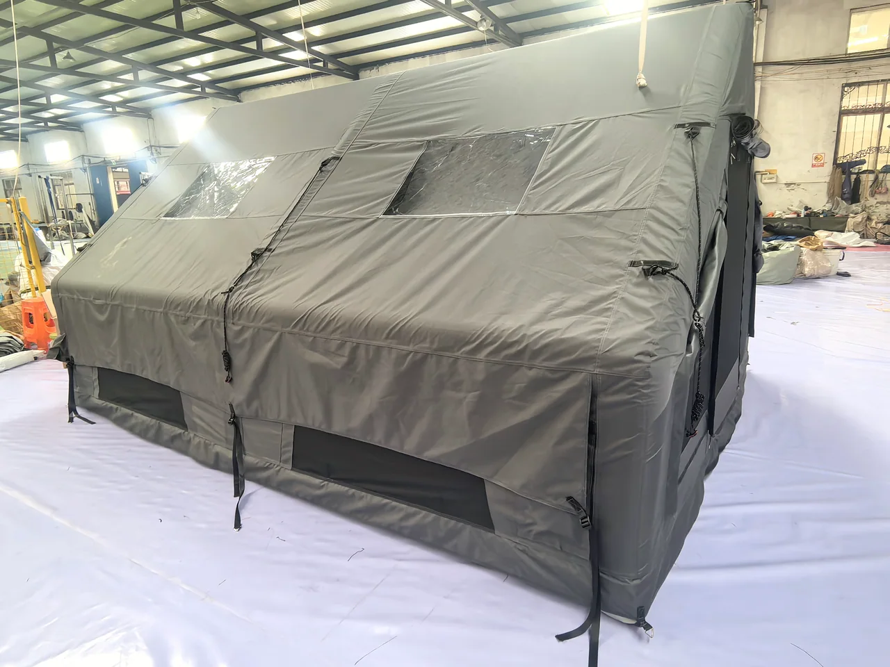 Twelve square metre inflatable family tent viewed from the front corner