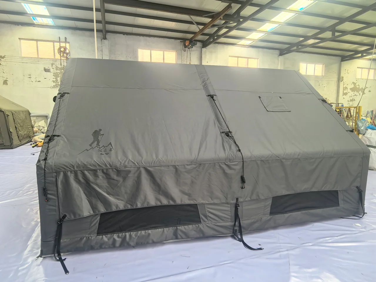 Front and side openings of a twelve square metre inflatable tent